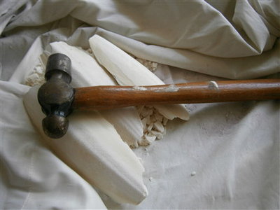 smahed with a hammer after wrapping in material likea towl