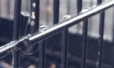 The hindge is up and down so door opens outward.  Not wrapped around a side bar.  HELP