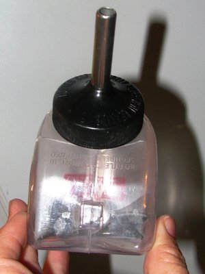 Front view of the drinker -- you can see the size compared to my hand.